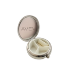 Silver pill box with branding on a white background
